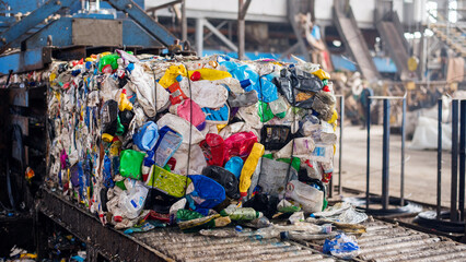 Compressed plastic garbage at waste sorting plant