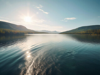 A tranquil lake reflecting the majestic mountains and clear blue sky in a serene natural environment.