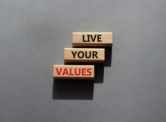 Live your values symbol. Concept words Live your values on wooden blocks. Beautiful grey background. Business and Live your values concept. Copy space.