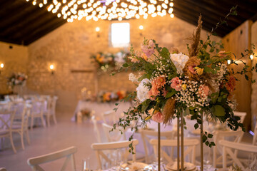 Luxury wedding table setting with flower centerpieces and candles