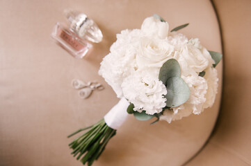 The bride's bouquet and the beautiful details of the bride's morning