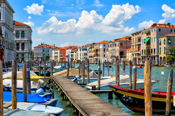 Scenic view of the Grand Canal with moored and sailing boats and gondolas in the center of Venice, Italy