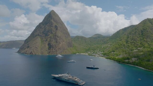 A yacht glides through the bay near Petit Piton in St Lucia