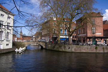 canal view of bridge and buildings Bruges Belgium