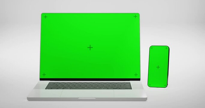 Green Screen Display Laptop Opens And Mobile Green Screen With Marks For Tracking
