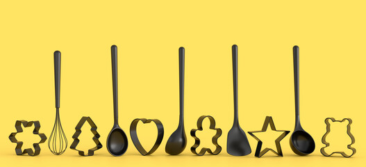 Set of metal cookie cutters and wooden kitchen utensils on monochrome background