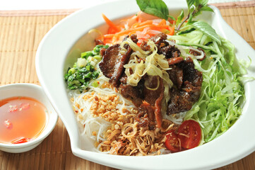 Lemongrass Beef Tenderloin with Lemon with chilli sauce served in dish isolated of table top view fast food snacks