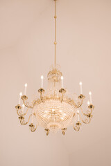 beautiful large gold chandelier with ornament