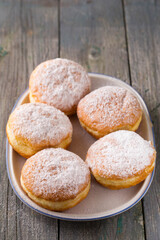 Ruddy delicious donuts berliners on an oval plate