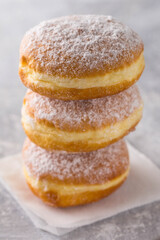 Three donuts stand on top of each other