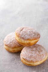 donuts with filling sprinkled with powdered sugar