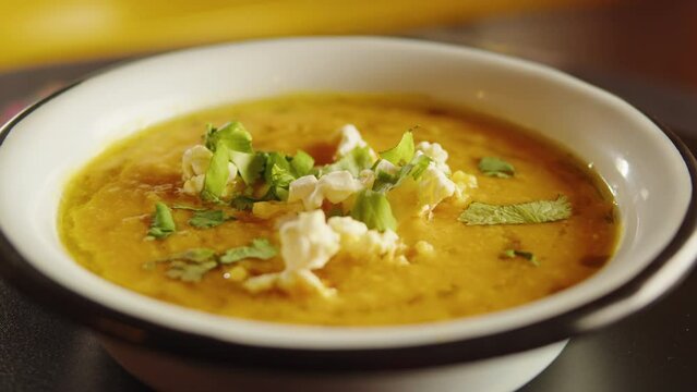 Mexican vegetarian vegan bean soup in cooking plate bowl, cream soup in tex mex American restaurant, Vegan or vegetarian healthy food concept