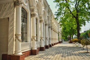 The building with Roman columns decorated with openwork stucco. Spring cityscape