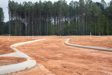 New home residential subdivision development of roads and curbs - obrazy, fototapety, plakaty