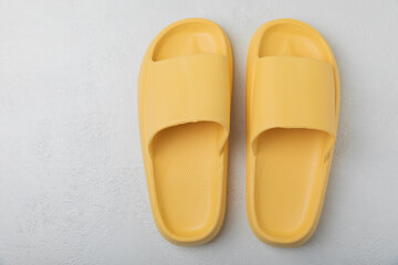 Home slippers on a white texture background. Indoor shoes. Flatley. Home cozy slippers for comfort. Close-up. Place for text. Copy space.