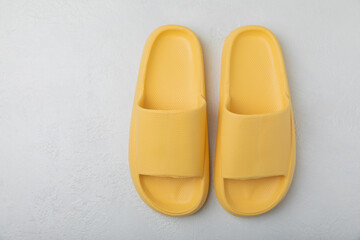 Home slippers on a white texture background. Indoor shoes. Flatley. Home cozy slippers for comfort. Close-up. Place for text. Copy space.
