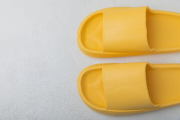 Home slippers on a white texture background. Indoor shoes. Flatley. Home cozy slippers for comfort. Close-up. Place for text. Copy space.