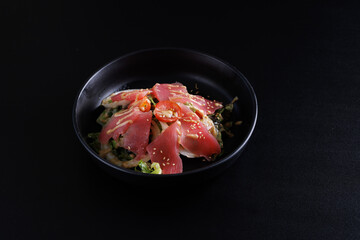 Japanese salad isolated in black background