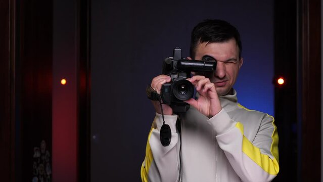 cameraman shoots video on an old vintage vhs camcorder