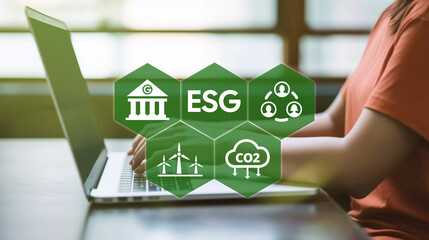 ESG concept for environmental, social, and governance in sustainable and ethical business and investment on the Network connection on a green background with a women and laptop. 