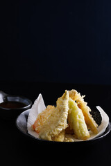 Mix tempura with shrimp fish and vegetable Japanese food isolated in black background - 589310763