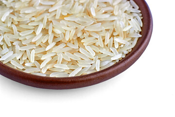 Indian basmati rice in a clay ceramic bowl close-up isolated on a white background