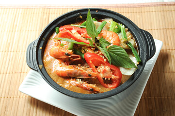 Satay Vermicelli Shrimp Casserole served in borth isolated on table top view of Claypot