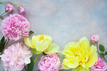 Yellow and pink flowers, peonies, roses on a colorful decorative background, copy space.
