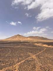 Merzouga, Morocco, Africa, panoramic road in the Sahara desert in the Black Mountain area, with...