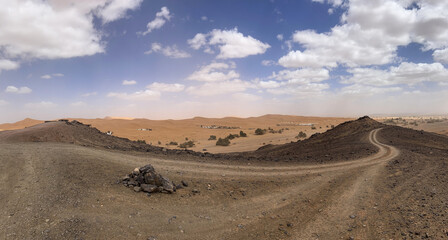 Merzouga, Morocco, Africa, panoramic road in the Sahara desert in the Black Mountain area, with...