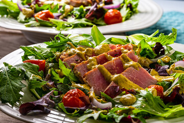 Pan seared tuna on greens.