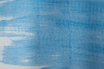 Close up of blue paint on white background with copy space
