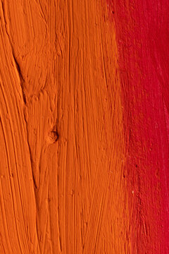 Close up of orange and red paint stripes with copy space