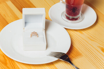 Beautiful new pair of elegant white gold wedding rings and white gold engagement ring, white square ring box.