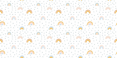 Abstract rainbow seamless pattern illustration. Soft pastel color doodle rainbows in childish freehand style for children or cute background design.	
