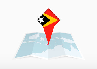 East Timor is depicted on a folded paper map and pinned location marker with flag of East Timor.