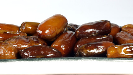 close up of dates on a white background