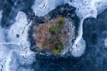 Aerial view of a Massachusetts lake island surround by ice 