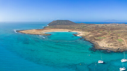 Aerial panoramic view of the beautiful secluded natural bay of the island of Lobos near Corralejo in Fuerteventura Spain