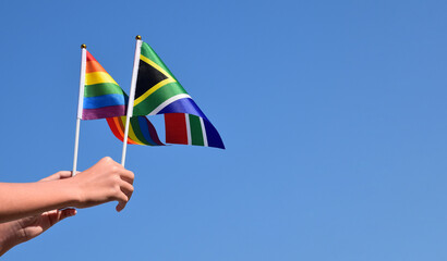 Isolated South Africa flag and rainbow flag with clipping paths