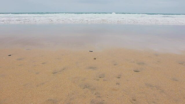 Perran Sands UK Tide coming in waves lapping against the beach