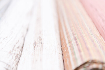 Collection of fashionable fabrics. Samples of different natural fabrics for sewing a fashion collection of clothes. Large selection of fabrics in the store or tailor warehouse.