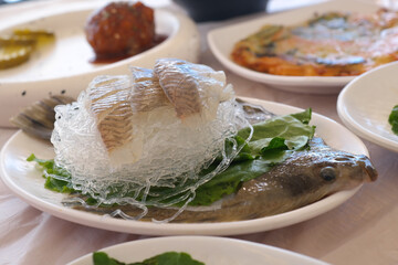 Flounder sashimi is served raw.