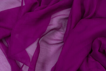 Fototapeta premium Collection of fashionable fabrics. Samples of different natural fabrics for sewing a fashion collection of clothes. Large selection of fabrics in the store or tailor warehouse.