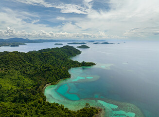 Aerial drone of coast with rainforest and tropical islands in the bay. Borneo. Sabah, Malaysia.