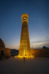 Evening view of famous minaret Kalyan in Bukhara with beatiful lights, Uzbekistan - 589367981