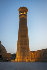 Evening view of famous minaret Kalyan in Bukhara with beatiful lights, Uzbekistan - 589367987