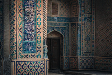 Old and colorful facade of old madrasah in Bukhara, Uzbekistan - 589367988