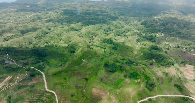 Aerial drone of countryside with agricultural land in the mountains. Libo hills. Cebu island, Philippines.