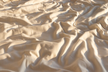 Fototapeta na wymiar close up white bed sheet with sunset light